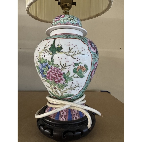 1060 - A Chinese style table lamp with shade.