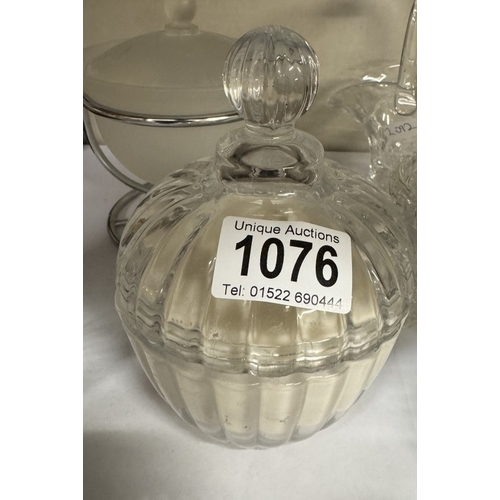 1076 - A quantity of glass items including powder, puff jars etc