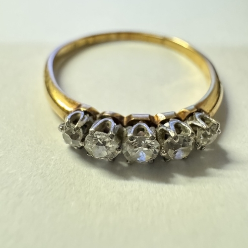 1001 - An 18ct gold 3 stone diamond ring. 2.18 grams. Size Q