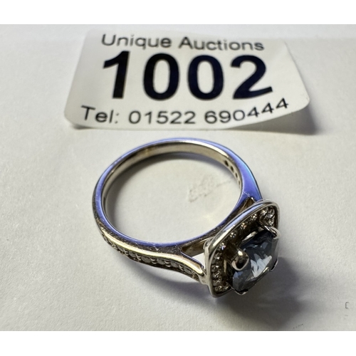 1002 - An 18ct white gold quality sapphire diamond ring. Size M