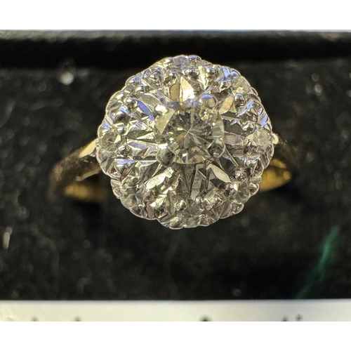 1004 - An 18ct yellow gold floral diamond ring. 2.86 grams. Size P