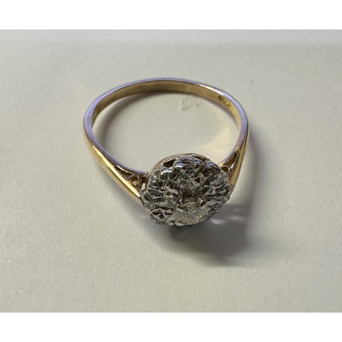 1004 - An 18ct yellow gold floral diamond ring. 2.86 grams. Size P