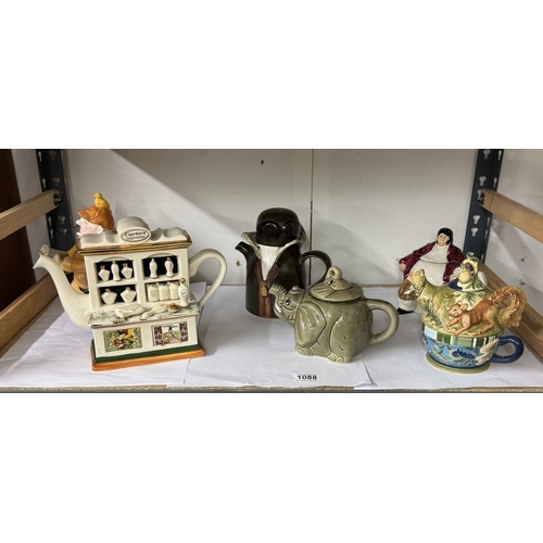 1088 - A quantity of decorative teapots including Carters Perfumery