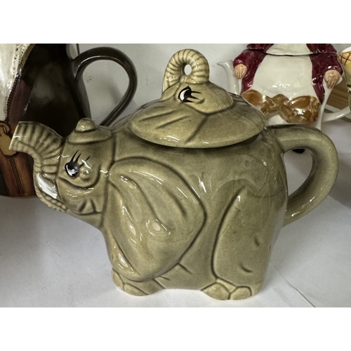 1088 - A quantity of decorative teapots including Carters Perfumery