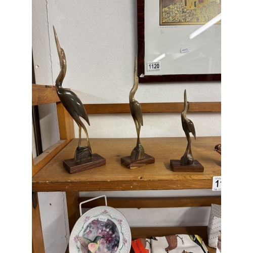 1121 - A quantity of bird related items including Goebel bluetit, Beswick foal & Corgi dog etc (2 shelves)