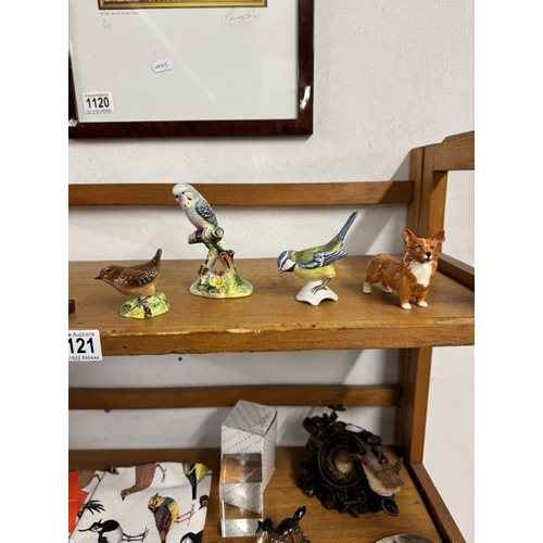 1121 - A quantity of bird related items including Goebel bluetit, Beswick foal & Corgi dog etc (2 shelves)