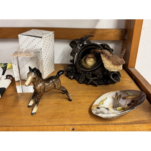 1121 - A quantity of bird related items including Goebel bluetit, Beswick foal & Corgi dog etc (2 shelves)