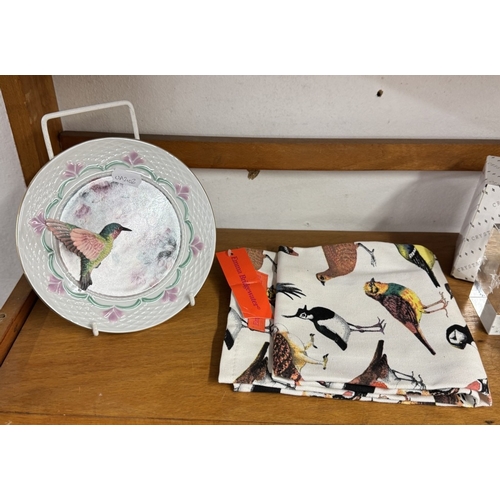 1121 - A quantity of bird related items including Goebel bluetit, Beswick foal & Corgi dog etc (2 shelves)