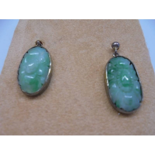 1020 - A pair of silver and jade pendant earrings.