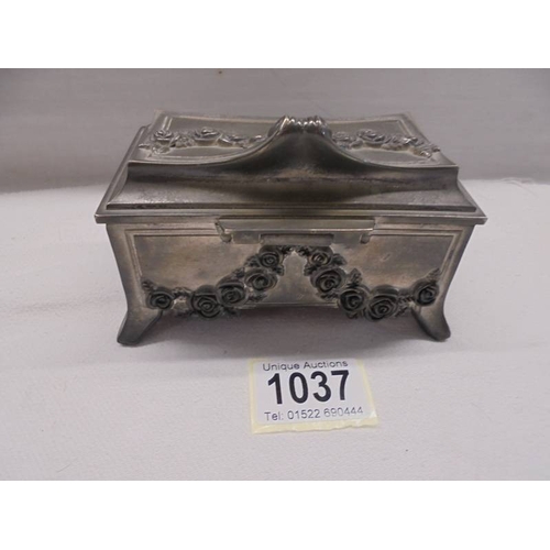 1037 - A good French spelter jewellery casket.