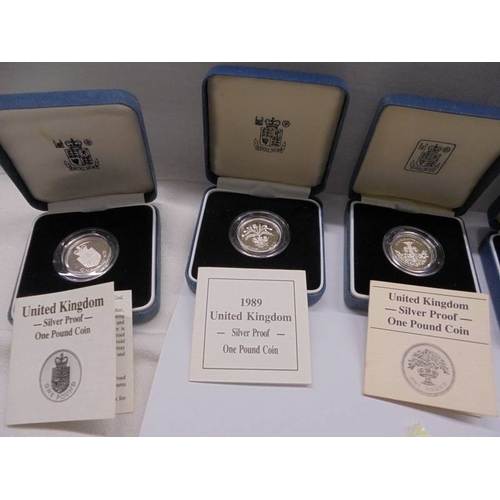 1106 - Five cased mint silver proof £1 coins.