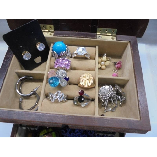 1116 - A jewellery box with assorted rings, earrings, necklaces etc.,