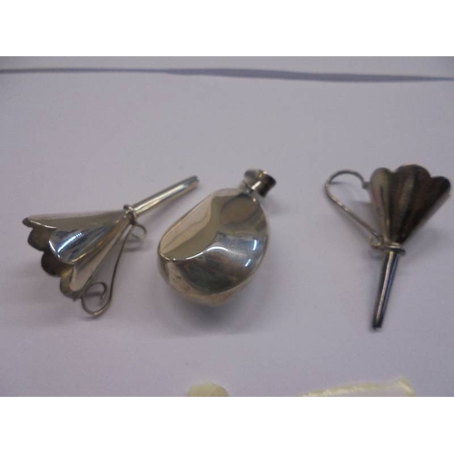 1039 - A silver pendant perfume bottle and two silver perfume funnels.