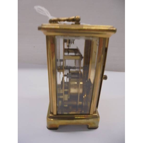 1213 - A brass carriage clock in full working order.