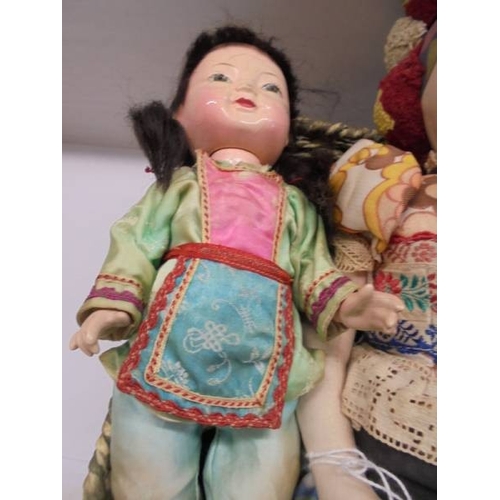 1224 - A Vintage Eastern European composition doll and two Japanese composition dolls.