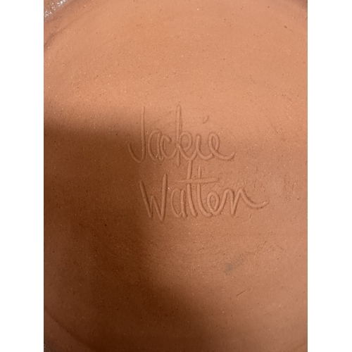 1480 - A large studio pottery terracotta charger by Jodie Watten. Diameter 41cm