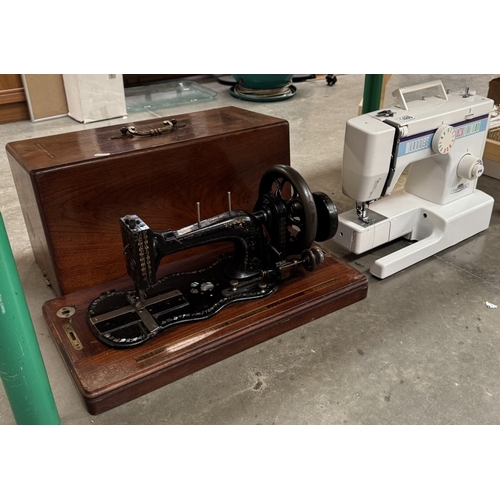 1486 - A Victorian cast iron sewing machine decorated with mother of pearl & An electric sewing machine wit... 
