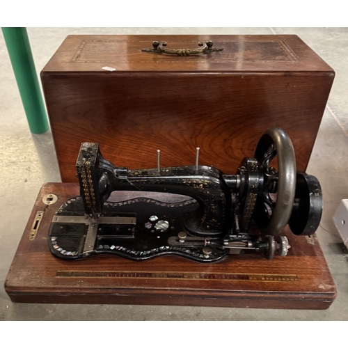 1486 - A Victorian cast iron sewing machine decorated with mother of pearl & An electric sewing machine wit... 