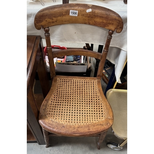 1506 - An early 20th century chair with wicker seat