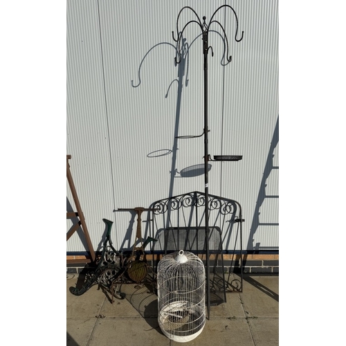 1574 - A quantity of metal items including bird cage, gates, bench ends etc