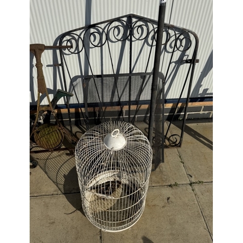 1574 - A quantity of metal items including bird cage, gates, bench ends etc