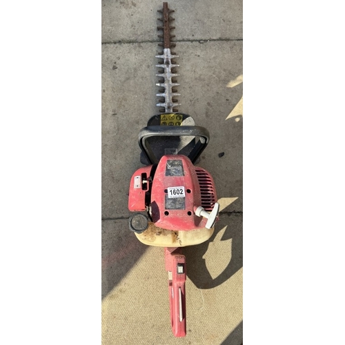 1602 - A petrol hedge trimmer