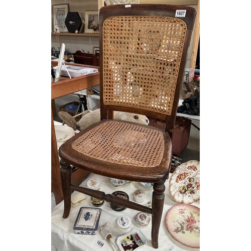1607 - An early 20th century chair with bergere seat & back panel