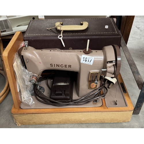 1617 - A cased Singer sewing machine (with treadle)