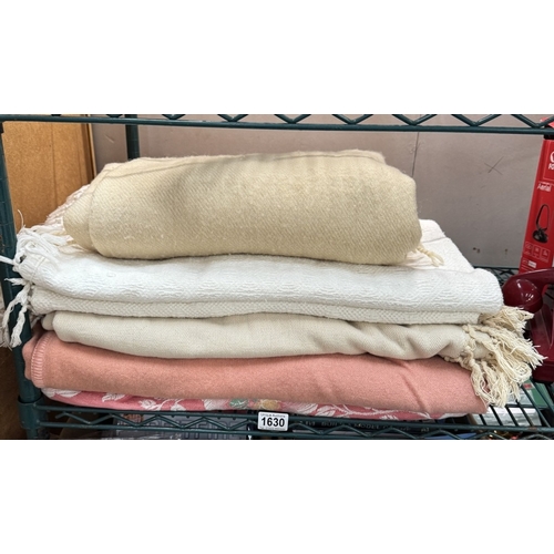 1630 - A quantity of bedspreads & blankets
