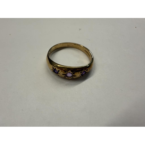 1026 - A 9ct gold ring set three amethysts, size M half, 2 grams.