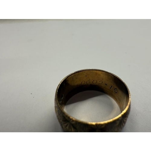 1022 - A 9ct gold wedding ring with engraved design, size N half, 6.08 grams.