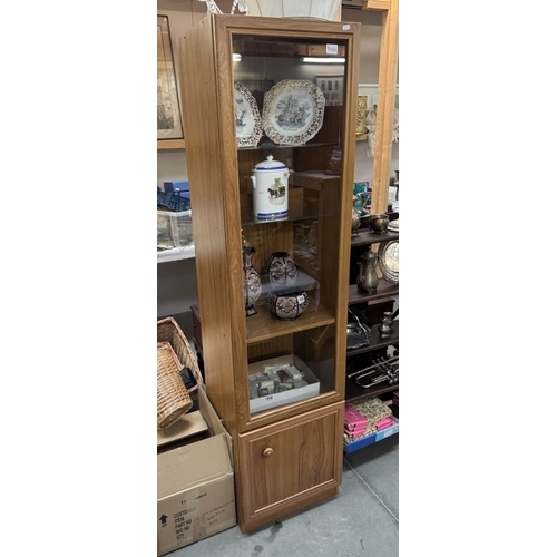 1695 - A pine effect modern tall display cabinet