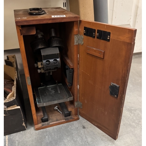 1709 - A cased microscope