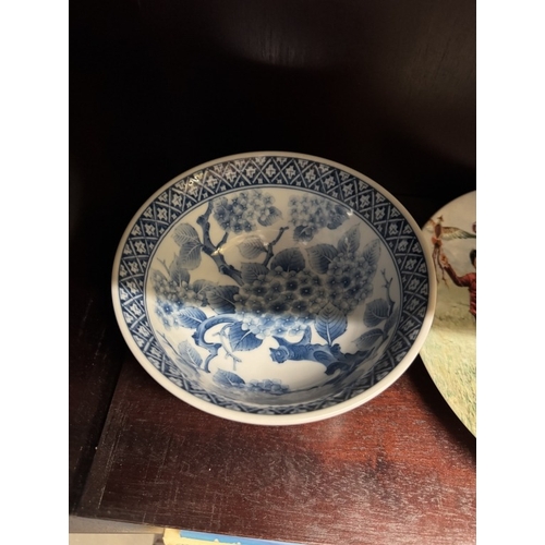 1716 - A quantity of Chinese ceramic collectors plates & A quantity of blue & white bowls