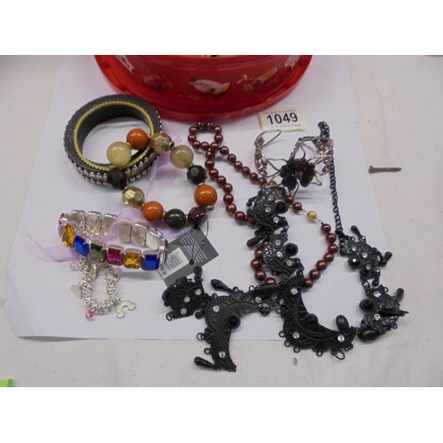 1049 - A mixed lot of necklaces, bracelets, rings etc., (clean and not broken).