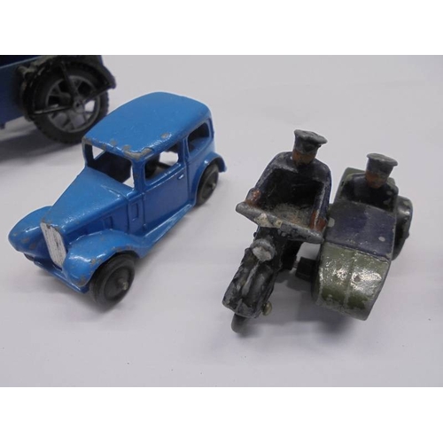 1128 - A collection of Post war Dinky AA & Police motor cycle with sidecars, Auctin 7 etc.,