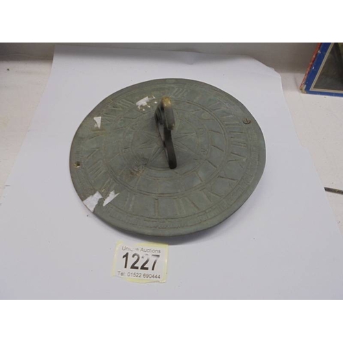 1227 - An old brass sundial.