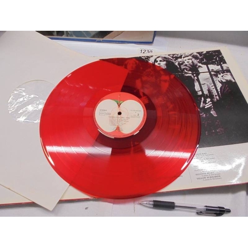 1230 - A Beatles album on red vinyl 1962-1966 (only on disc) and a Beatles album of blue vinyl with two dis... 