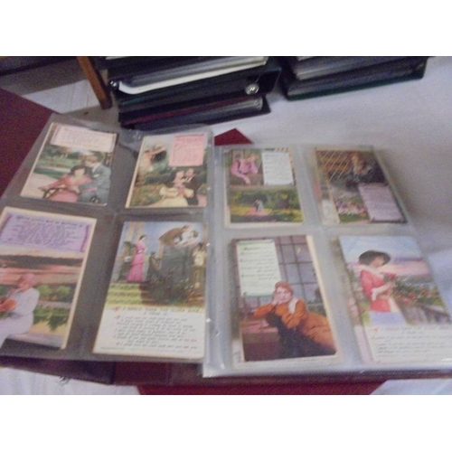 1300 - Two large albums of early 20th century postcards.