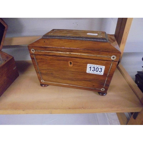 1303 - A Victorian mahogany tea caddy.