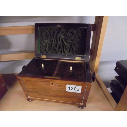 1303 - A Victorian mahogany tea caddy.