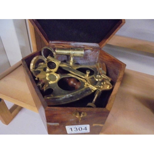 1304 - A brass sextant in mahogany case.