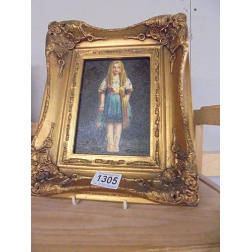 1305 - A gilt framed enhanced print of a young girl.