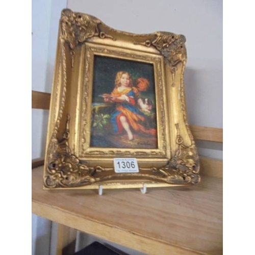 1306 - A gilt framed enhanced print of a young girl with dog.