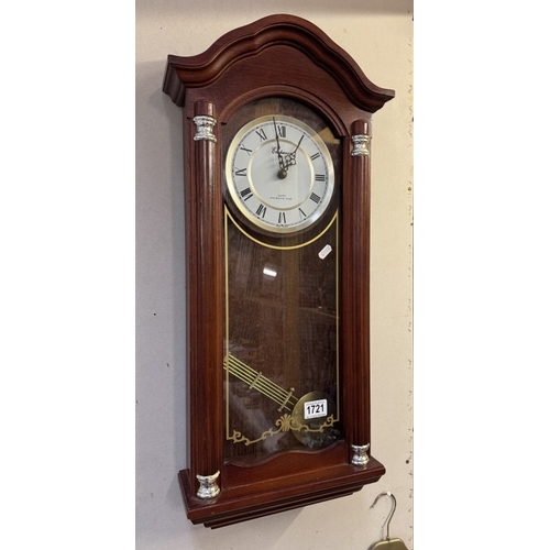 1721 - A modern quartz wall clock with Westminster chimes