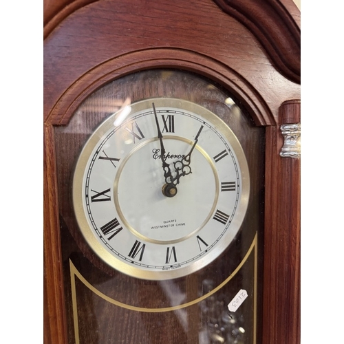 1721 - A modern quartz wall clock with Westminster chimes