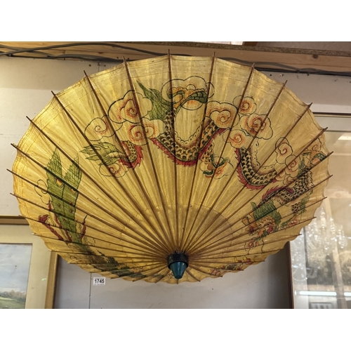 1745 - An oriental parasol with dragon design