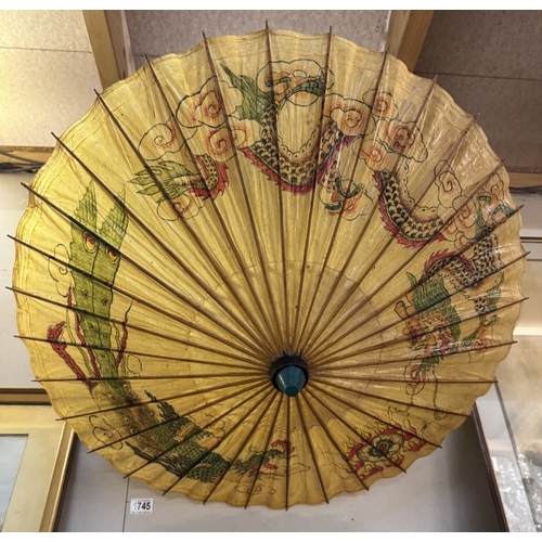 1745 - An oriental parasol with dragon design