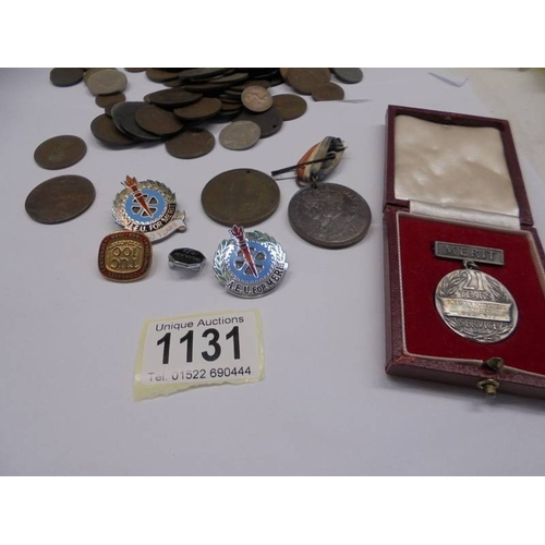 1131 - A mixed lot of coins and some medals and badges.