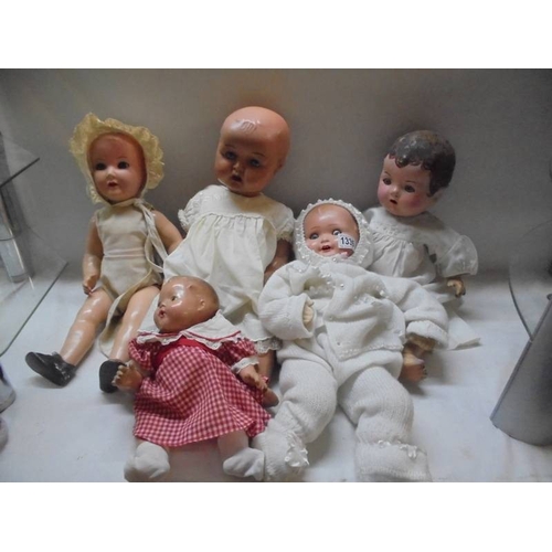 1335 - Five vintage composition dolls including some with porcelain heads.